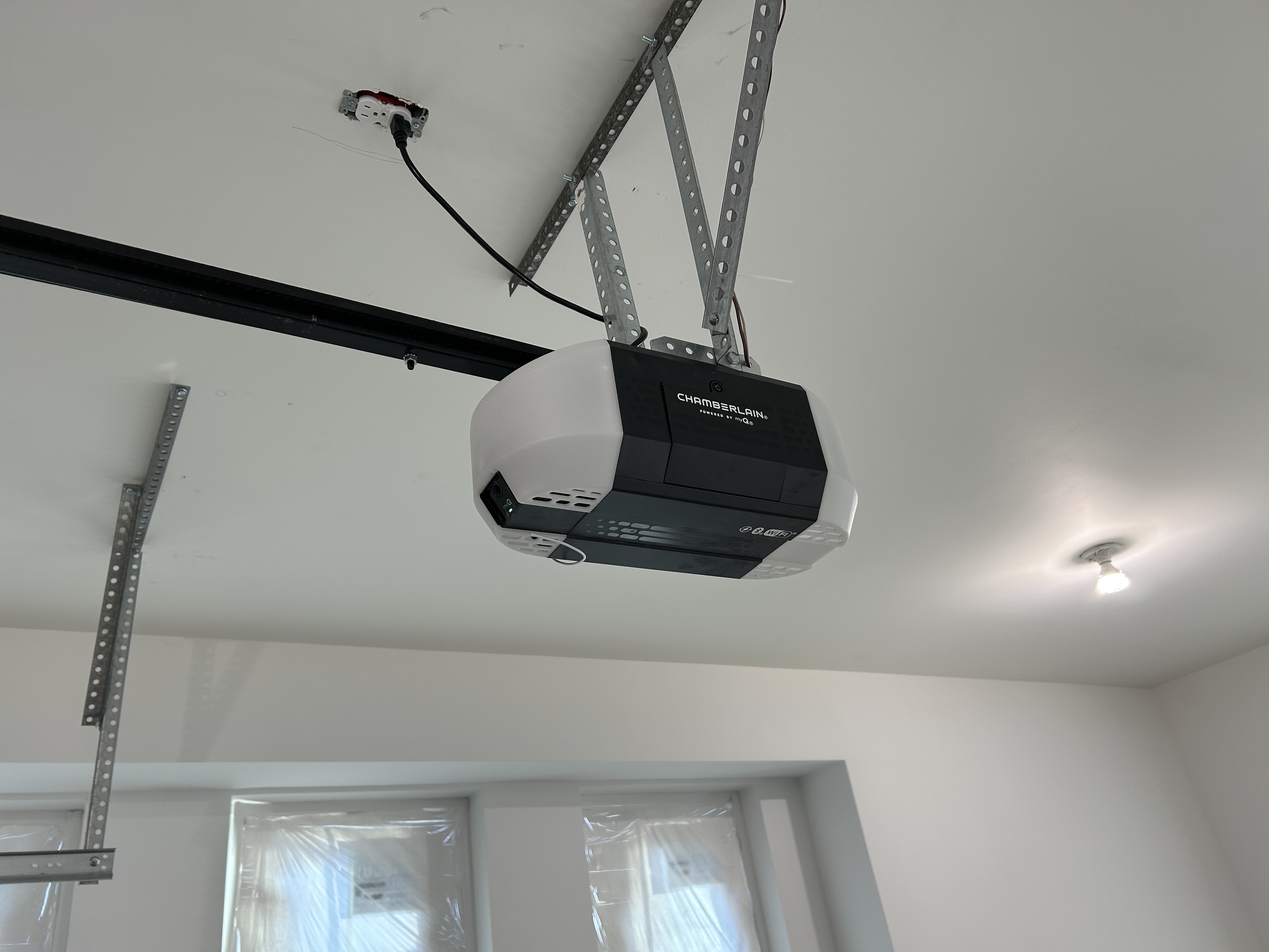 Chamberlain garage door opener installed on a residential garage ceiling
